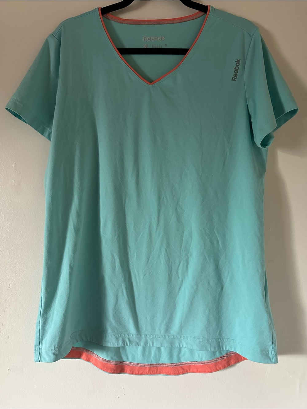 Reebok Women’s V-Neck Short Sleeve Tee in Aqua with Coral Trim